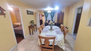 a dining room with a table and chairs at Gran casa copiapo hasta 10 personas in Copiapó