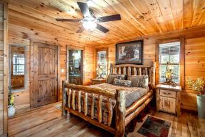 a bedroom with a bed and a ceiling fan at Blue View Mountain in Murphy