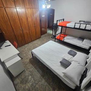 a room with two bunk beds and a desk at Saint Charles Hostel in São Carlos +20 photos