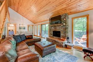 a living room with a couch and a fireplace at Paws A While in Blowing Rock