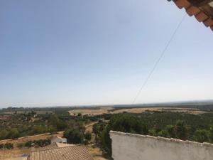 a view of the countryside from the top of a building at HACIENDA LA MACARENA DE SEVILLA in Cantillana +56 photos