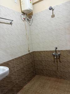 a bathroom with a sink and a shower at The urban rest in Shillong +35 photos
