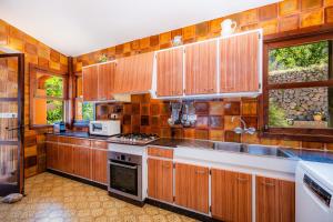 Kuchyň nebo kuchyňský kout v ubytování Ses Merjades