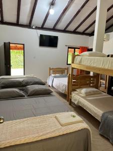 Ένα ή περισσότερα κρεβάτια σε δωμάτιο στο Lagos de Mararay