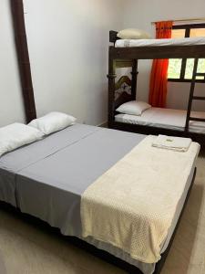 Ένα ή περισσότερα κρεβάτια σε δωμάτιο στο Lagos de Mararay +1 φωτογραφίες