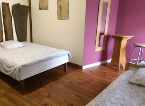 Postel nebo postele na pokoji v ubytování Gite Le Ry De Pouzioux + 4 fotografie