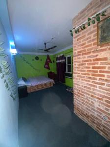 A bed or beds in a room at Home made guest house and netflix