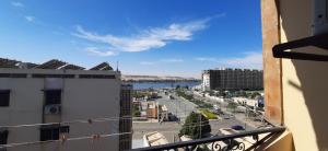 a view of a city from a balcony at Downtown Apartment in Aswan