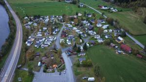 an aerial view of a parking lot with cars at Nordnes Kro og Camping in Rokland +46 photos