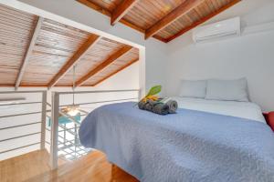a bedroom with a bed and a wooden ceiling at Villaggio 6 Parque al Lago, Playa Potrero in Potrero +92 photos