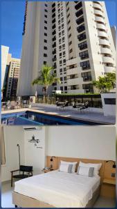 Habitación de hotel con cama frente a un edificio en Quarto 5 estrelas no Comfort Suites!, en Brasilia