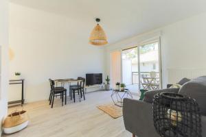 Et opholdsområde på Appartement Les Verdiers dans résidence calme à Andernos