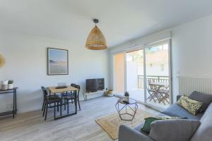 Et opholdsområde på Appartement Les Verdiers dans résidence calme à Andernos + 20 billeder