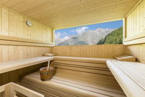 a sauna with a view of a mountain at Josephus - Domicilium II in Madonna +9 photos