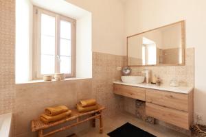 a bathroom with a sink and a mirror at La Petite Bastide in Sanary-sur-Mer +15 photos