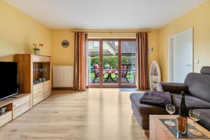 TV a/nebo společenská místnost v ubytování Fewo Pippert