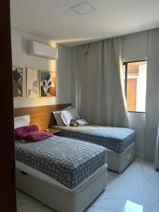 Ένα ή περισσότερα κρεβάτια σε δωμάτιο στο Casa Lírio Bananeiras