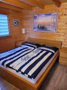 Postel nebo postele na pokoji v ubytování Ferienhaus Seeblick
