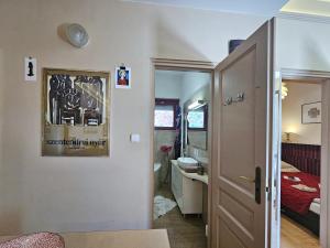 a small room with a bathroom and a bedroom at Art Styles Boutique Apartment Szentendre in Szentendre +28 photos