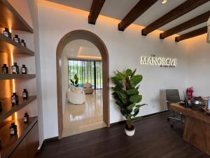 an arched doorway into a salon with a plant at The Mangrove at Carey Circles  +65 photos