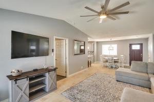 a living room with a flat screen tv and a couch at 2 Mi to Lake Havasu Home with Patio and Pool in Lake Havasu City