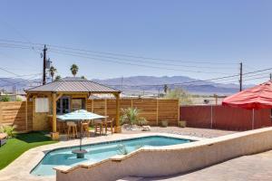 a backyard with a swimming pool and a gazebo at 2 Mi to Lake Havasu Home with Patio and Pool in Lake Havasu City