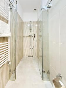 Et badeværelse på L'Heritage Collection Romana Apartments