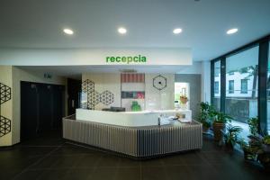 a lobby of a hospital with a reception desk at Viktoria - Park & Stay with a Castle View - Free Parking in Bratislava