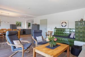 a living room with a table and chairs at Ferienhaus Kiliani in Bernau im Schwarzwald