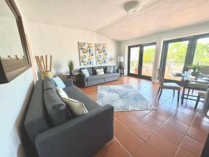 a living room with a couch and a table at Holiday Home at Rio Mar in Rio Grande