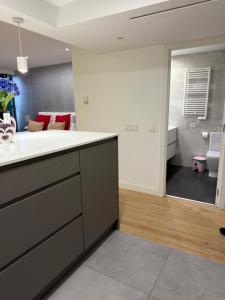 a bathroom with a sink and a toilet in a room at Gre Hostel San Benito in Madrid