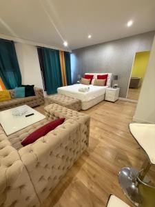 a living room with a couch and a bed at Gre Hostel San Benito in Madrid