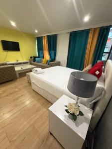 a bedroom with a bed and a table with a lamp at Gre Hostel San Benito in Madrid