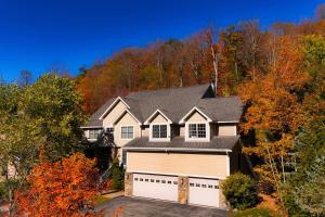 a house with a white garage at Summit Retreat Seven Springs in Champion