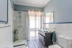 a bathroom with a shower and a sink and a toilet at Casa Blanca in Estepona +20 photos