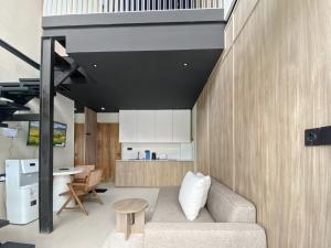 a living room with a couch and a table at Villa Byu By Local Property Team in Balian