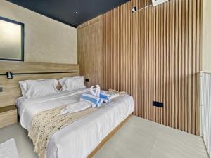 a bedroom with two beds with white sheets at Villa Byu By Local Property Team in Balian