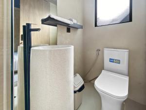 a small bathroom with a toilet and a shower at Villa Byu By Local Property Team in Balian +7 photos