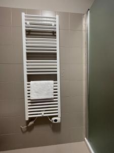 a towel rack in a bathroom with a shower at Vibo Centro Home in Vibo Valentia +34 photos