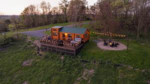 an overhead view of a tiny house in a field at Hillside Hideaway - Hot Tub in Brookville +14 photos