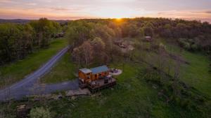 an aerial view of a house in a field at Hillside Hideaway - Hot Tub in Brookville