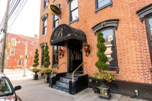 a brick building with an entrance to a restaurant at The Lancastrian House Downtown in Lancaster