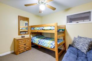 a bedroom with two bunk beds and a mirror at Dock, Views and Fire Pit Retreat on Lake Norman in Webbs