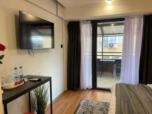 TV a/nebo společenská místnost v ubytování XIX Boutique