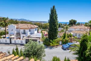 an aerial view of a villa with a parking lot at Casa May in La Cala de Mijas
