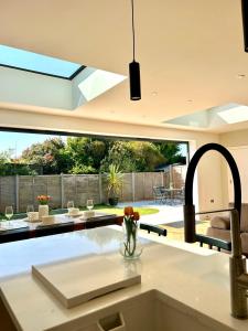 a kitchen with a sink and a counter top at The Crescent Villa Lancing in Lancing
