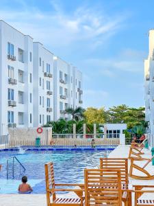 Bazén v ubytování Olas Caribe 401 nebo v jeho okolí