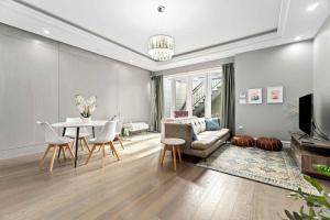 a living room with a couch and a table at Family guest suite in Marpole in Vancouver