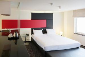 Ein Bett oder Betten in einem Zimmer der Unterkunft Hotel Tristar