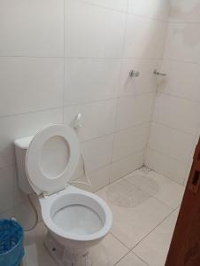 a bathroom with a toilet and a shower at hotel pousada Maanaim in Palmas +9 photos